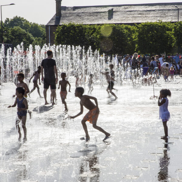 Fun in the Granary Square fountains on a hot summer's day in King's Cross
